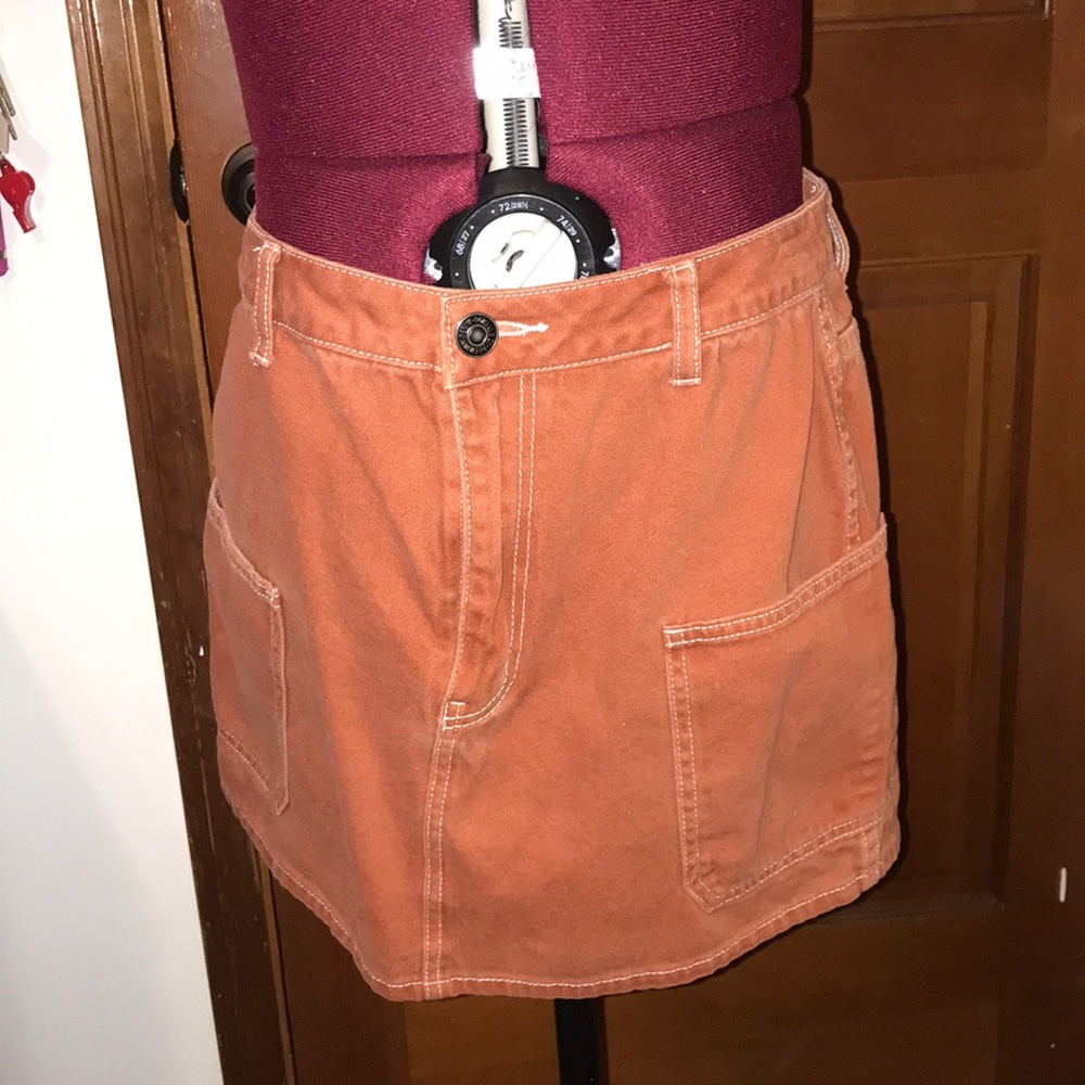 A brown skirt with white stitching.